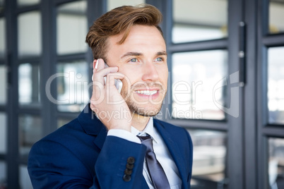 Businessman talking on smartphone