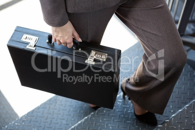 Close-up of businesswoman on staircase