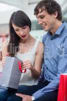 Couple looking in the shopping bag