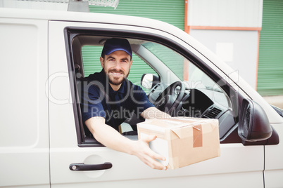 Delivery man sitting in his van