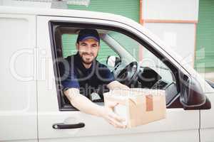 Delivery man sitting in his van