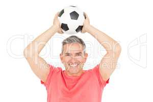 Smiling man holding football