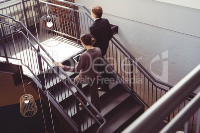 Businesspeople climbing the staircase