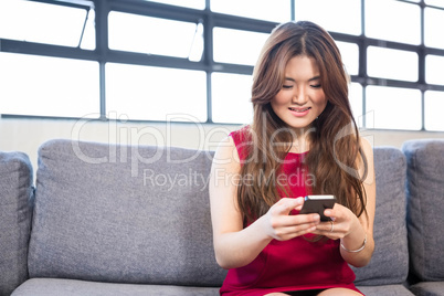 Beautiful business woman using mobile phone