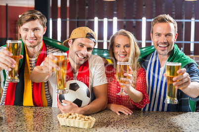 Friends toasting with beers