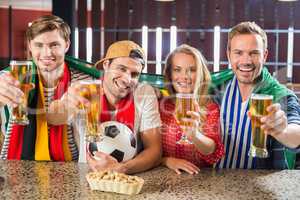 Friends toasting with beers