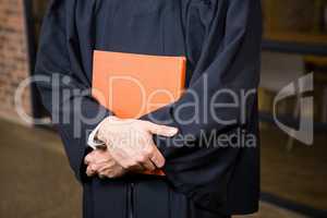 Lawyer holding a law book