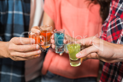 Friends toasting with shots