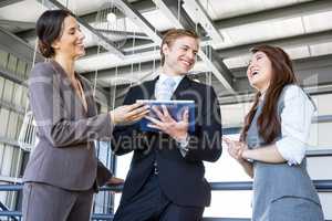 Three colleagues discussing in office