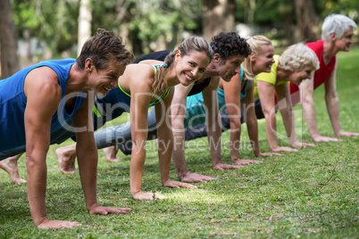 Fitness class practicing yoga