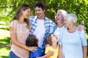 Smiling family hugging