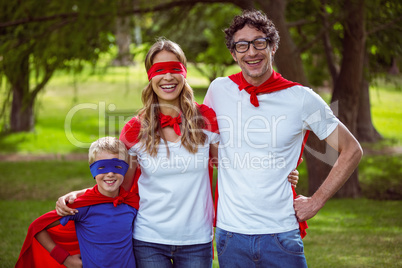 Happy family pretending to be superhero