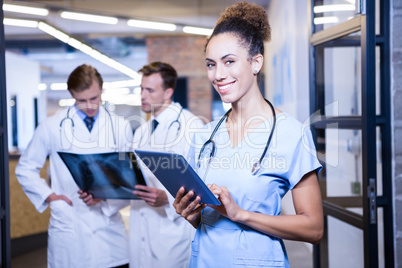 Portrait of female doctor with digital tablet