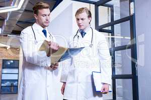 Doctors discussing a medical report