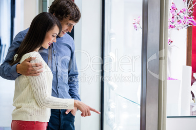 Happy couple shopping in mall