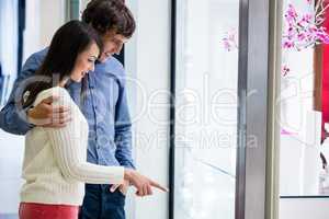 Happy couple shopping in mall