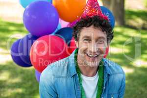 Smiling father at birthday party