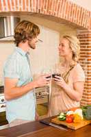 Cute couple enjoying a glass of wine