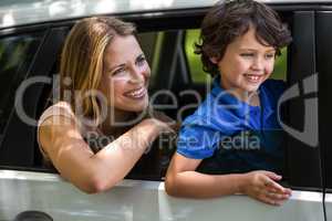 Mother and son sitting in a car