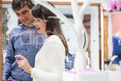 Happy couple shopping in mall