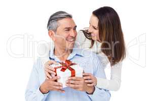 Pretty couple offering present to husband