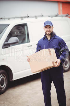 Delivery man holding box