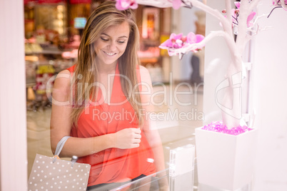 Beautiful woman window shopping