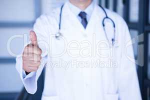 Male doctor showing thumbs up