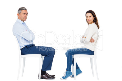 Couple arguing while sitting