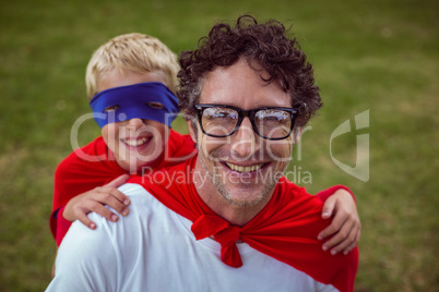 Father and son dressed as superman