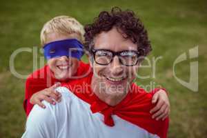 Father and son dressed as superman