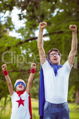 Father and son dressed as superman