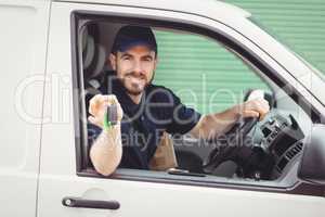 Delivery man sitting in his van