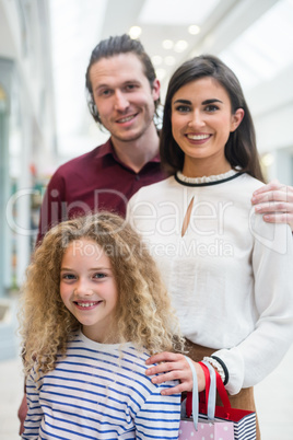 Happy family in shopping mall