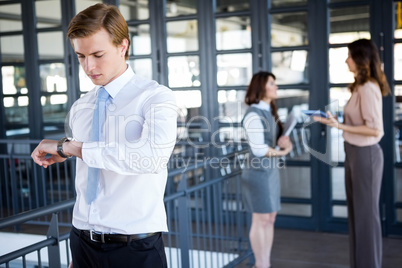 Successful businessman checking time