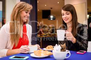 Women having coffee and snacks at a coffee shop