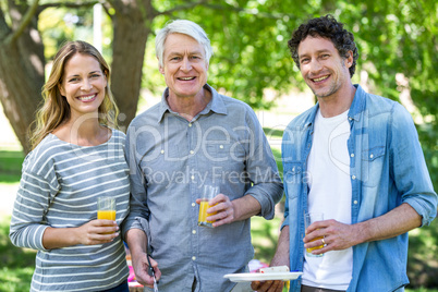 Family having a picnic with barbecue