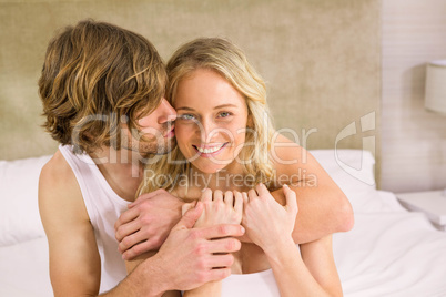 Nice man cuddling his girlfriend