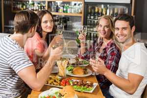 Friends toasting with white wine