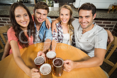 Friends toasting with beers