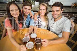 Friends toasting with beers