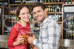 Couple toasting with beers