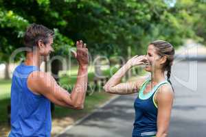 Fit people doing high five