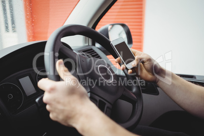 Delivery man driving his van