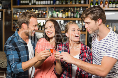 Friends toasting with shots