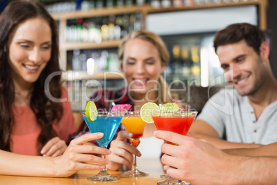 Friends toasting with cocktails