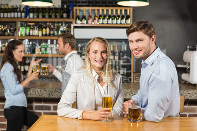 Couples holding beer