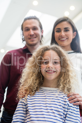 Happy family in shopping mall