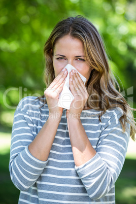 Woman using a tissue