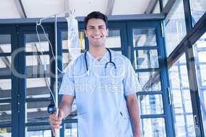 Doctor holding intravenous drip